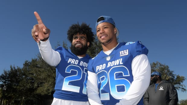 Jan 25, 2019; Kissimmee, FL, USA; Dallas Cowboys running back Ezekiel Elliott (26) and New York Giants running back Saquon Barkley (26) pose during NFC practice at ESPN Wide World of Sports Complex.